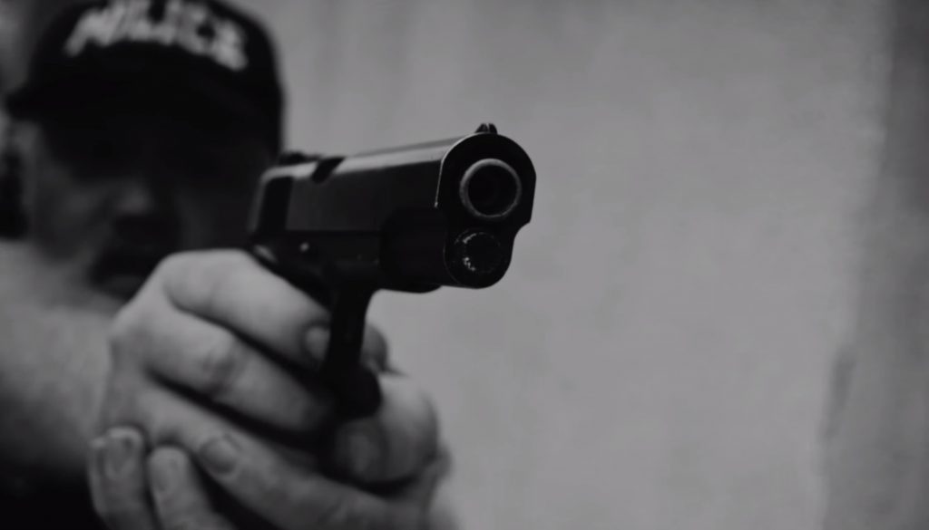 still from "Alright" depicting corruption within police forces