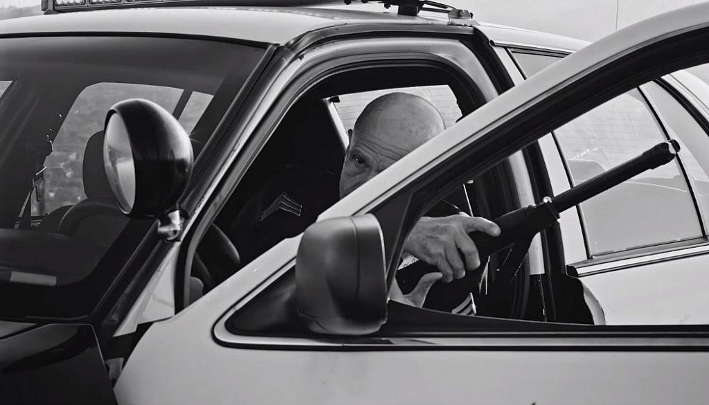 still from "Alright", a cop arrives on the scene as Lamar is delivering his message