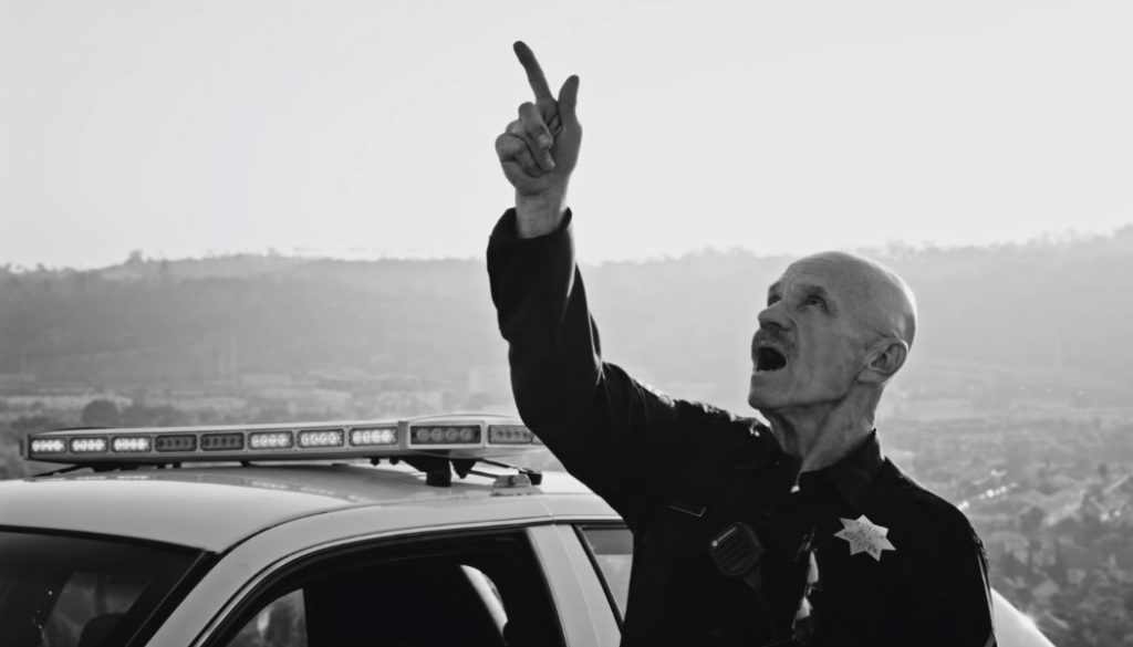 still from "Alright", the cop chooses to shoot Lamar with his gun, which (poetically) ends up being his own two fingers.