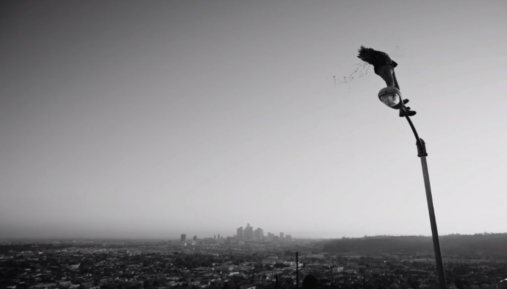 still from "Alright", Lamar is shot by the cop, falling from his ledge perched in the sky...cutting the message off.